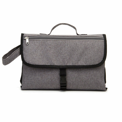 Maroon Asteria waterproof travel diaper change pad with multiple compartments, portable and suitable for on-the-go diaper changes.