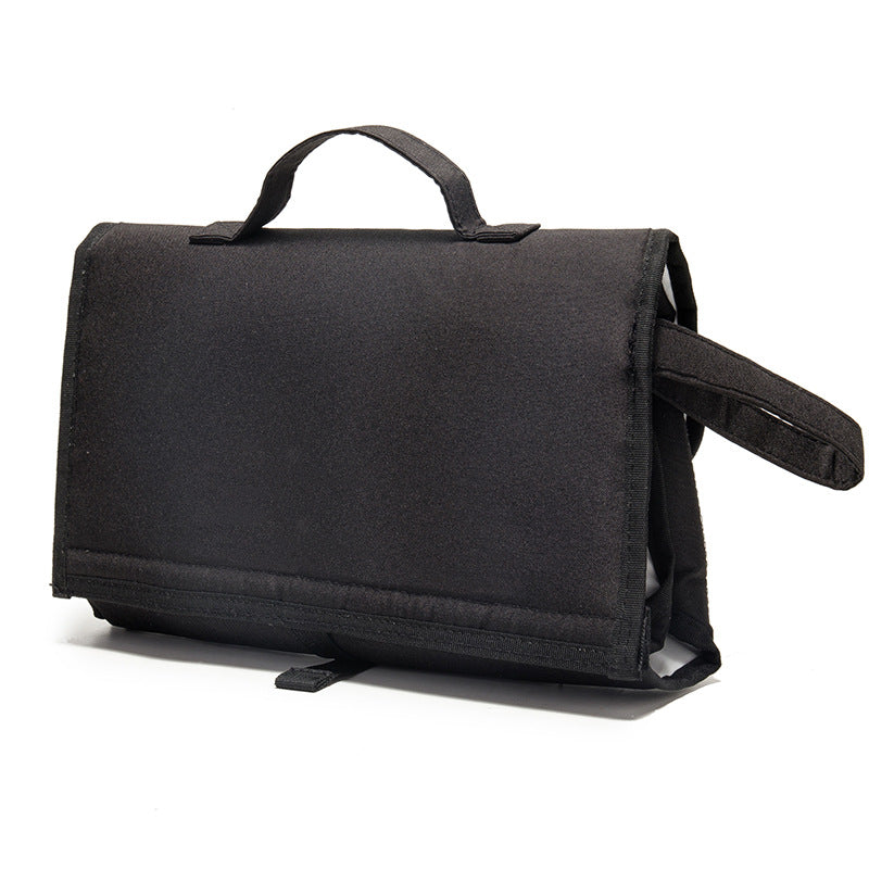 Maroon Asteria waterproof travel diaper change pad with multiple compartments, compact and portable for on-the-go diaper changes.