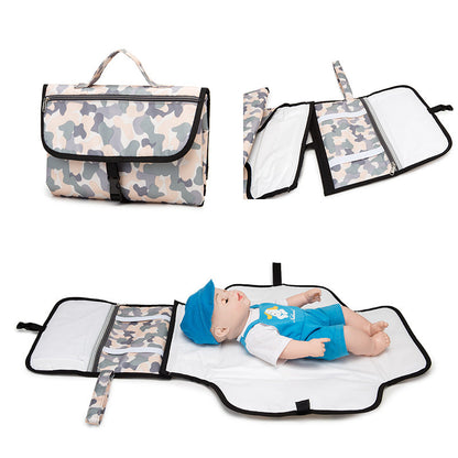 Maroon Asteria waterproof travel diaper change pad with multiple compartments, portable and suitable for parenthood on the go.