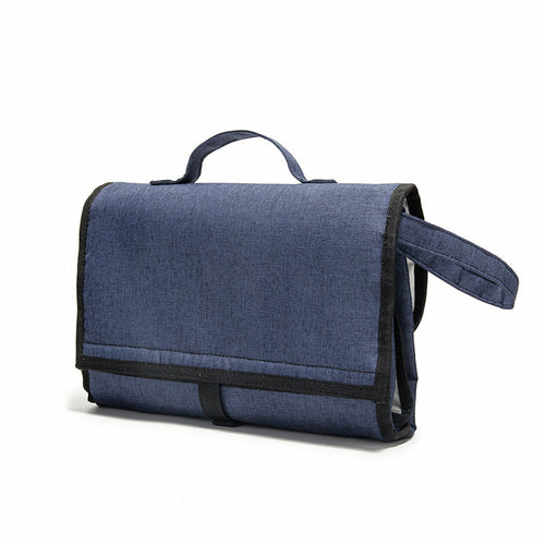 Maroon Asteria waterproof travel diaper change pad with multiple compartments, portable and suitable for on-the-go parent needs.