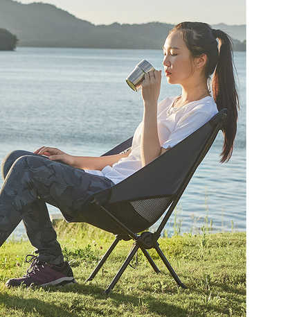 Maroon Asteria ultralight outdoor folding camping chair for picnics, featuring a compact, foldable design suitable for camping trips.