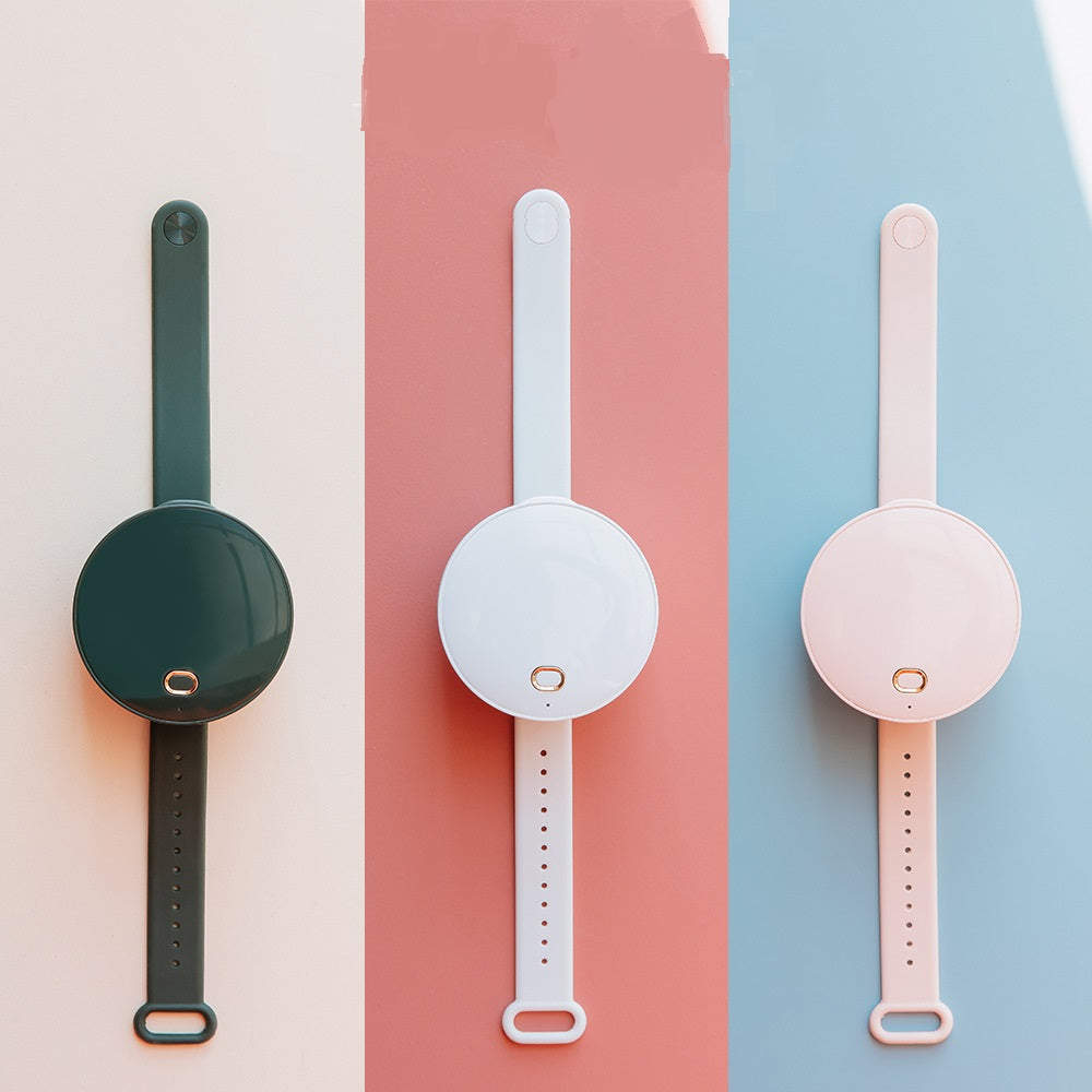 Maroon Asteria portable wrist fan with mirror, leafless design, USB rechargeable, and 3-speed settings for home improvement tasks.