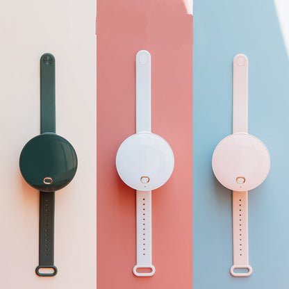 Maroon Asteria portable wrist fan with mirror, leafless design, USB rechargeable, and 3-speed settings for home improvement tasks.