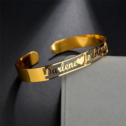 Personalized LuxeJewels™ custom name cuff bracelet in stainless steel with engraved name, designed by Carmine Juneberry.