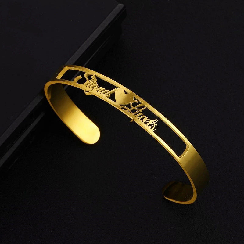 Personalized LuxeJewels™ stainless steel name cuff bracelet with custom engraving, stylish jewelry by Carmine Juneberry.