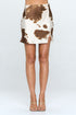 Cow print satin mini skirt with slit from Jade Icarus, featuring a stylish cow pattern and a flattering slit detail.