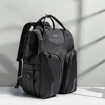 Carmine Juneberry SmartMom Travel+ diaper backpack with multiple compartments and padded shoulder straps for moms on the go.