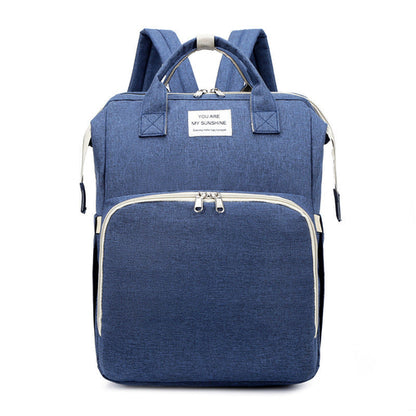 Carmine Juneberry ALLFASHION™ FoldAway BabyNest Backpack with adjustable straps and compact foldable design for easy carrying.