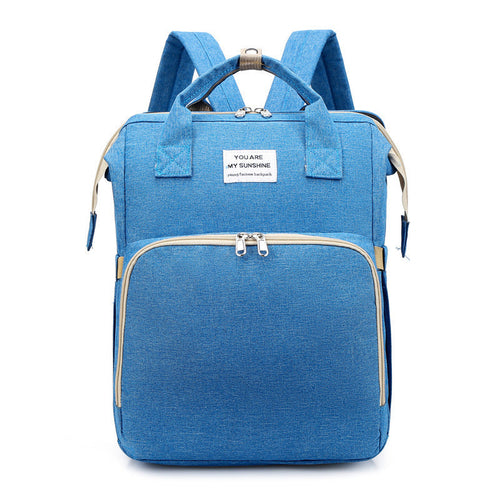 Carmine Juneberry ALLFASHION™ FoldAway BabyNest Backpack with adjustable straps and compact design, suitable for carrying a baby nest.