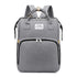 Carmine Juneberry ALLFASHION™ FoldAway BabyNest Backpack with adjustable straps and compact foldable design, shown open and packed.
