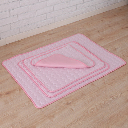 Maroon Asteria pet summer portable ice silk cooling pad on a bed, designed to keep pets cool and comfortable during hot weather.