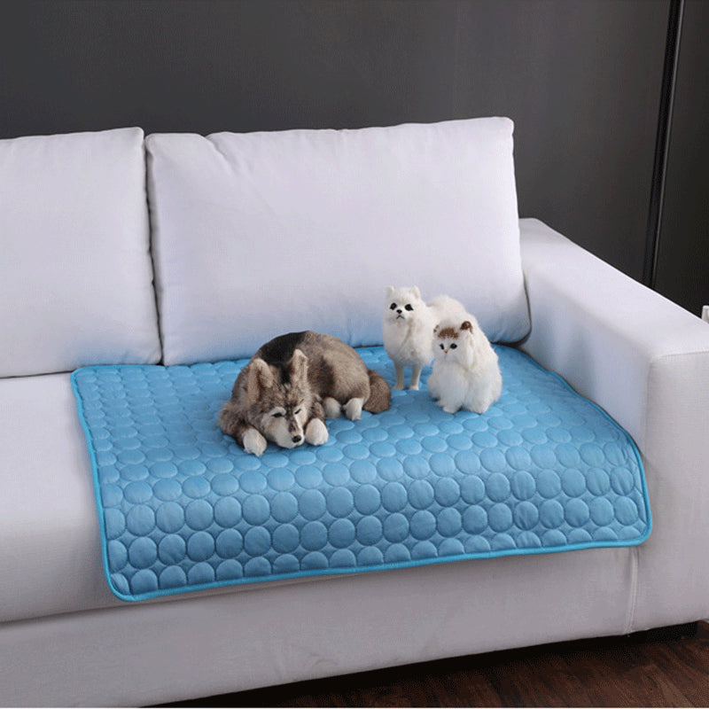 Maroon Asteria pet summer portable ice silk cooling pad on a bed, designed to keep pets cool and comfortable during hot weather.