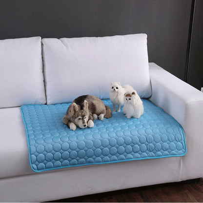 Maroon Asteria pet summer portable ice silk cooling pad on a bed, designed to keep pets cool and comfortable during hot weather.
