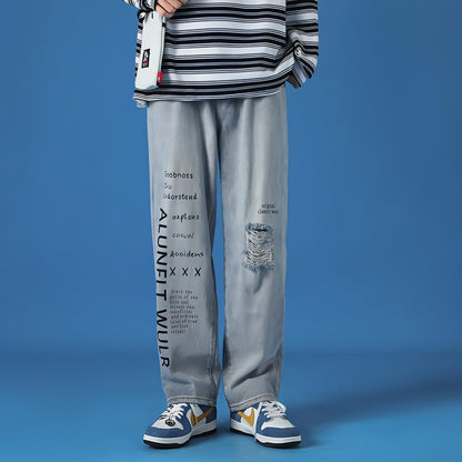Light blue washed casual jeans for men, loose fit style by Carmine Juneberry, shown laid flat with front pockets and relaxed cut.