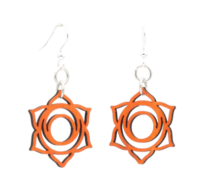 Red Sunflower Svadhishthana Chakra wood earrings featuring carved orange and brown designs, hanging from silver hooks.