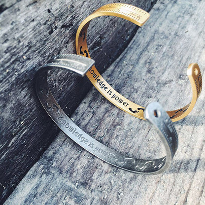 Fuchsia Molly ruler bracelet featuring a sleek metal band with engraved measurement markings, stylish and modern jewelry accessory.
