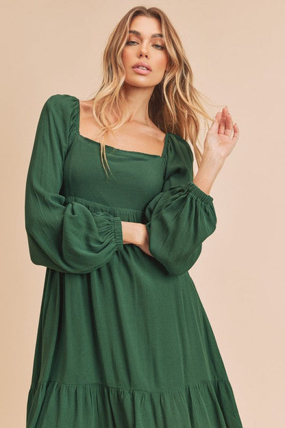Jade Icarus Taya dress for women, featuring a stylish, flowy design with floral patterns and a V-neck, perfect for casual wear.