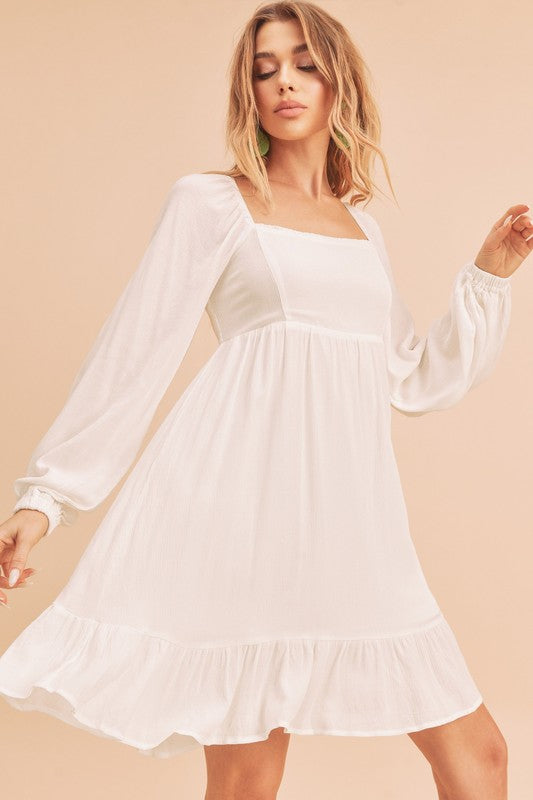 Jade Icarus Taya Dress for women, featuring a stylish, flowing design with a floral pattern and fitted waist.