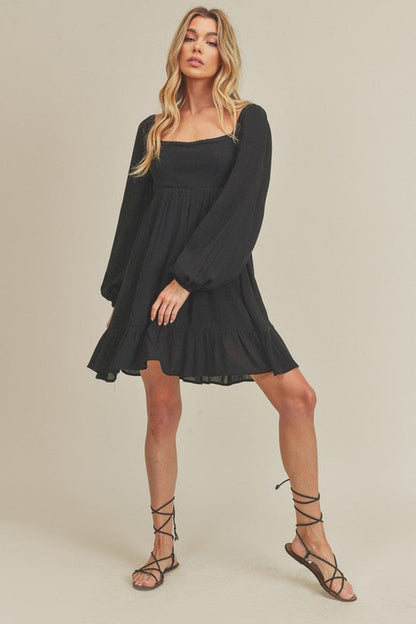 Jade Icarus Taya Dress for women, stylish and flowy, shown in a vibrant color with a fitted bodice and elegant skirt.