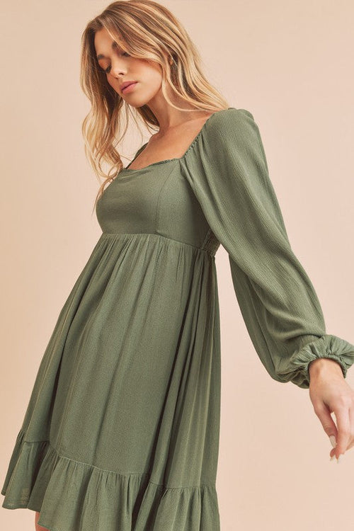 Elegant Taya Dress by Jade Icarus for women, showcasing a flowing silhouette and stylish design in a vibrant color.