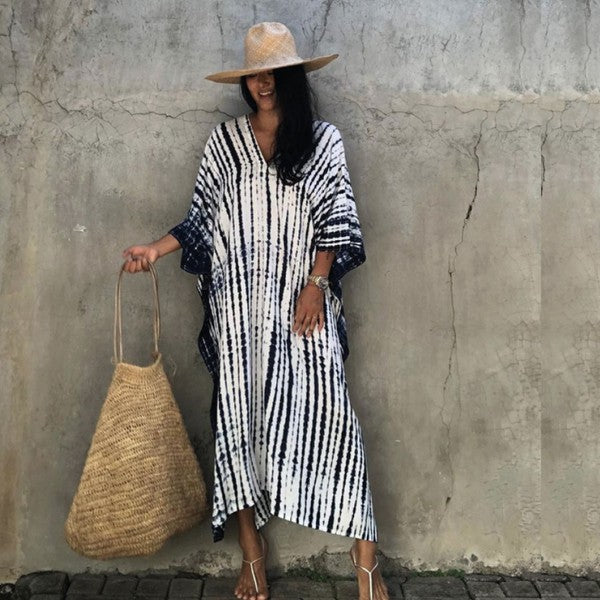 Jade Icarus Gio Wide Dress and Beach Cover Up displayed on a mannequin, featuring a flowing, lightweight fabric in a stylish design.