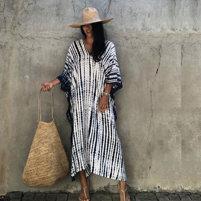 Jade Icarus Gio Wide Dress and Beach Cover Up displayed on a mannequin, featuring a flowing, lightweight fabric in a stylish design.