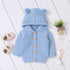 Carmine Juneberry KuschelGlöckchen™ baby hooded knit jacket with pom-pom, soft and cozy for little ones.