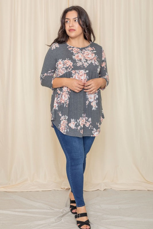 Plus floral curved hem tunic from Jade Icarus, featuring a flowy silhouette, vibrant floral pattern, and curved hem design.