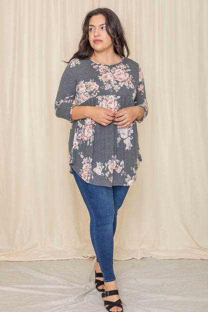 Plus floral curved hem tunic from Jade Icarus, featuring a flowy silhouette, vibrant floral pattern, and curved hem design.