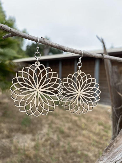 Red Sunflower tipped petal earrings featuring delicate floral design, showcased in a lifestyle setting.