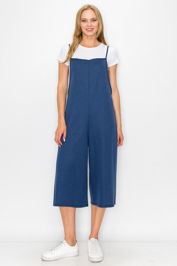 Blue oversized jumpsuit with cropped wide-leg bottoms, by Yellow Hera, shown on a model in a casual dress style.