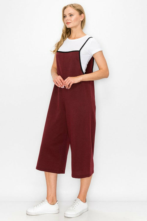 Burgundy oversized jumpsuit with cropped wide-leg bottoms from Yellow Hera, featuring a relaxed fit and stylish design.