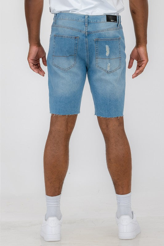 Distressed stretch denim shorts from Jade Icarus designed for automotive use, featuring a rugged, worn-in look.