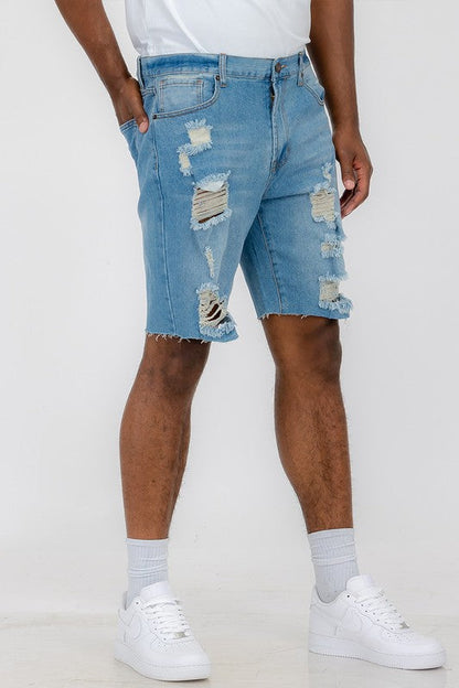 Distressed stretch denim shorts in automotive style by Jade Icarus, featuring a rugged, worn look with distressed detailing.