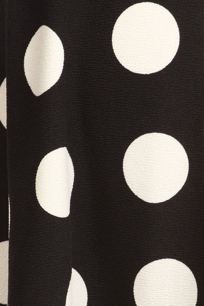 Polka dot printed high waisted knee-length skirt from Jade Icarus, showcasing the fabric pattern and stylish design details.