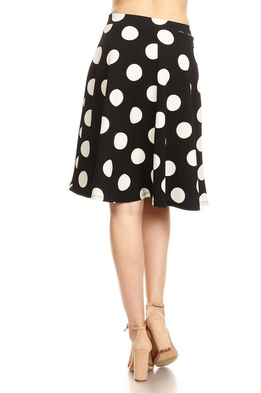 Polka dot printed high waisted knee-length skirt by Jade Icarus, featuring a stylish and feminine women&