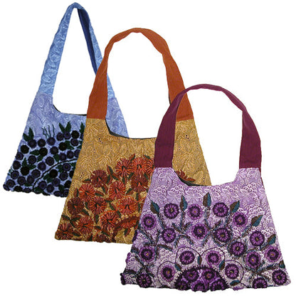 Recycled Rococo trapezoid handbag by Erin Hercules featuring colorful De Colores design, handmade accessories from Guatemala.