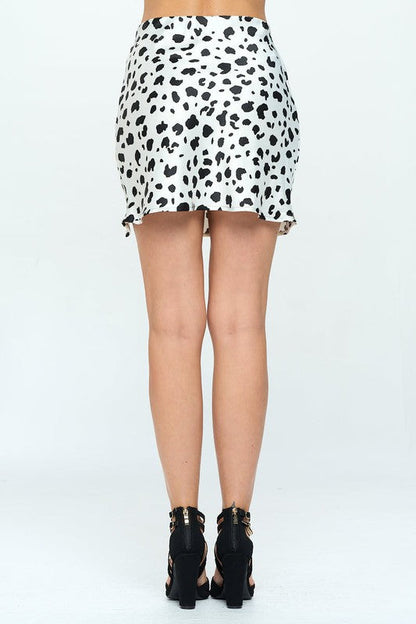 Leopard print satin mini skirt with slit by Jade Icarus, featuring a stylish, fitted design and bold animal print pattern.