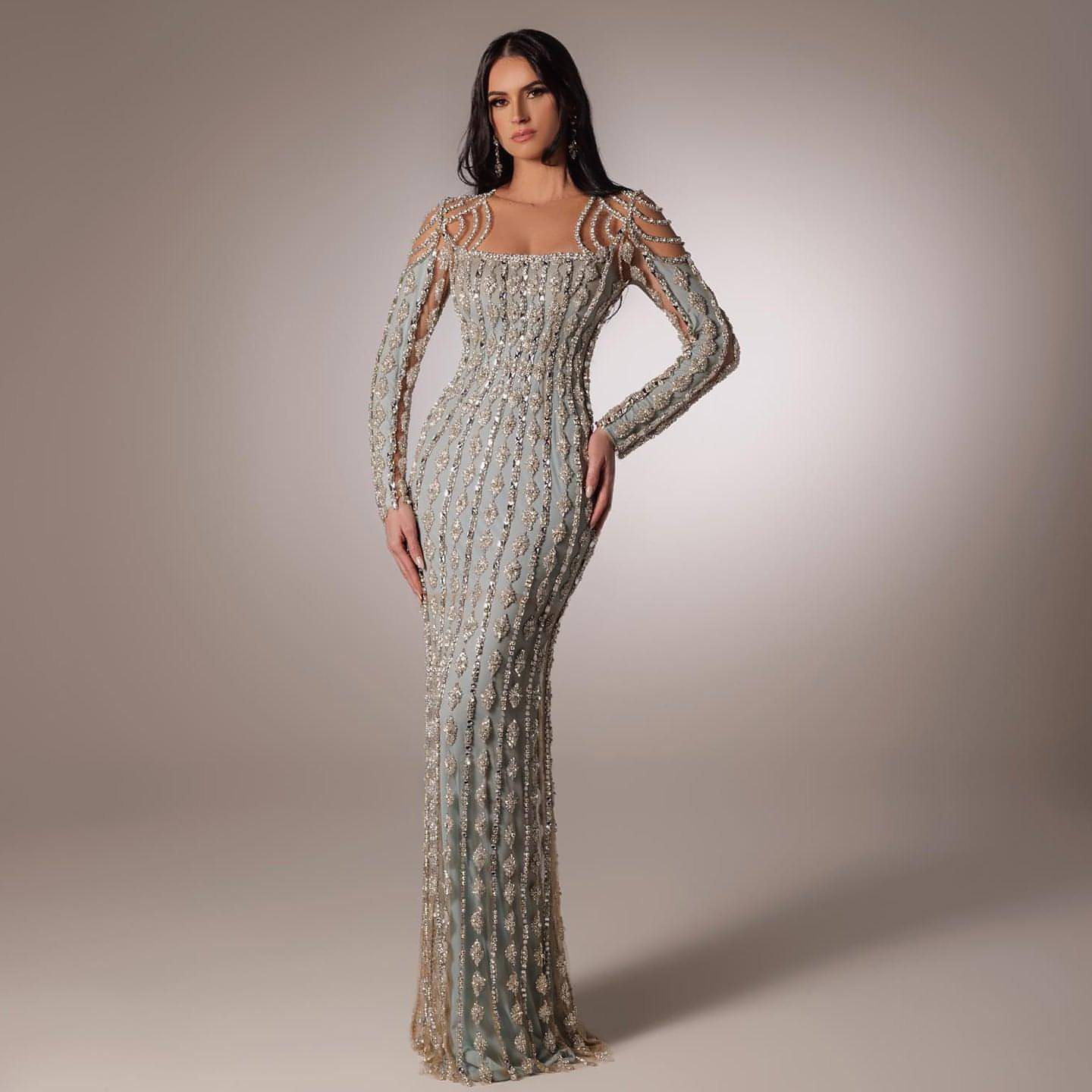Carmine Juneberry long sleeve slim fishtail dress with fitted silhouette and elegant design, shown in a stylish fashion image.