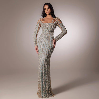 Carmine Juneberry long sleeve slim fishtail dress with fitted silhouette and elegant design, shown in a stylish fashion image.