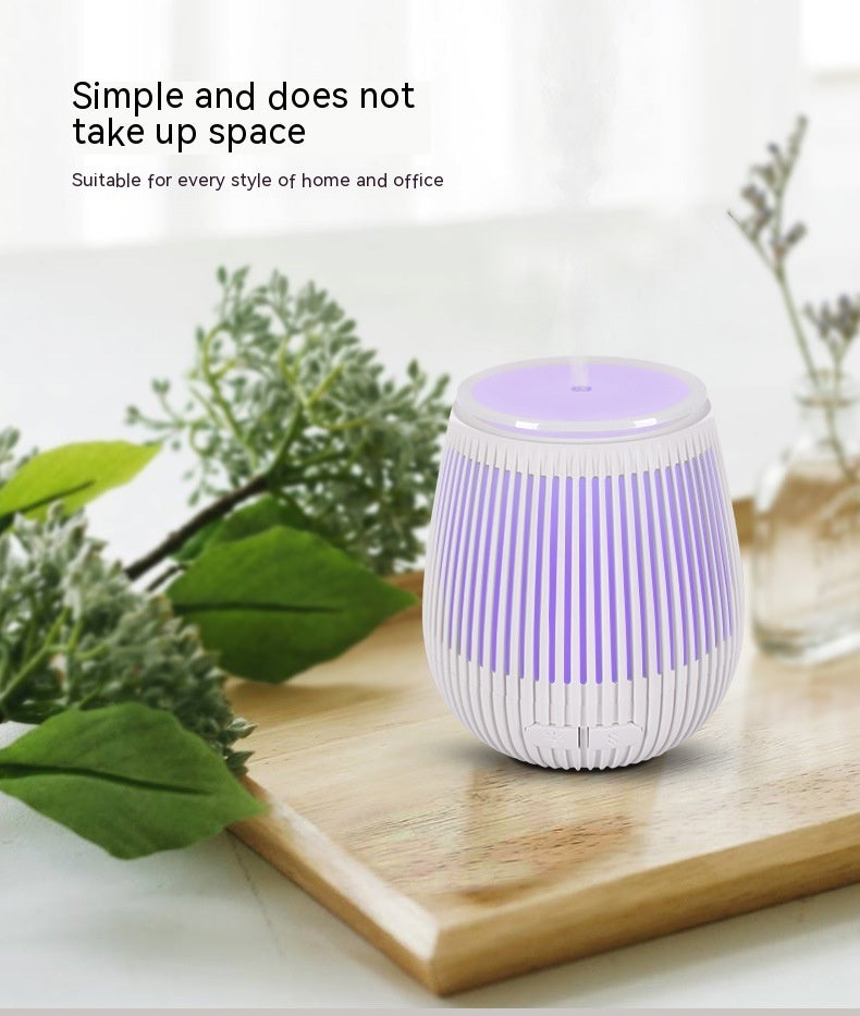 Colorful USB aromatherapy humidifier and fragrance lamp by Pink Lucky, featuring vibrant design and misting function.