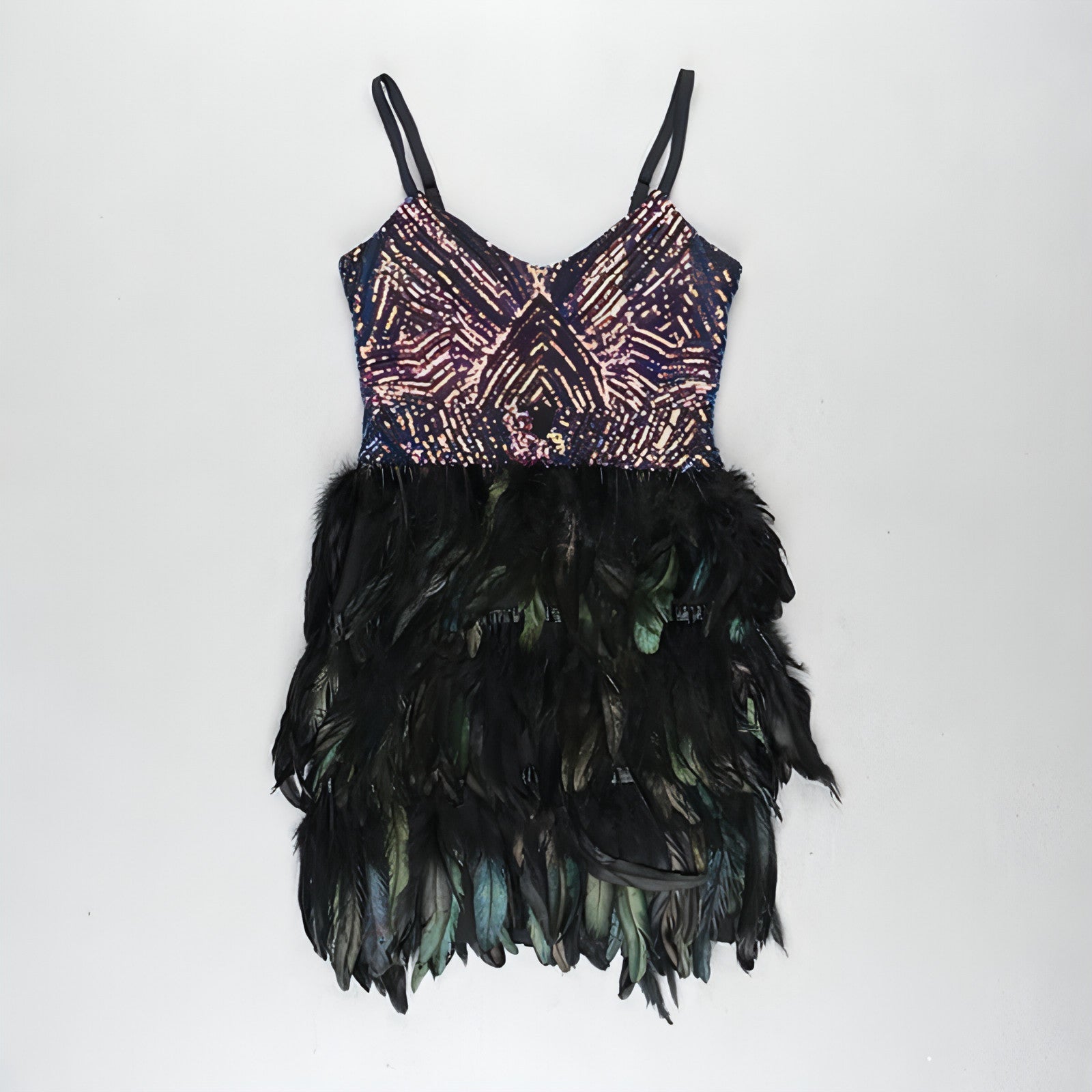 Carmine Juneberry sleeveless sequined dress with suspenders and tight fit, designed as a stylish skirt for fashionable wear.