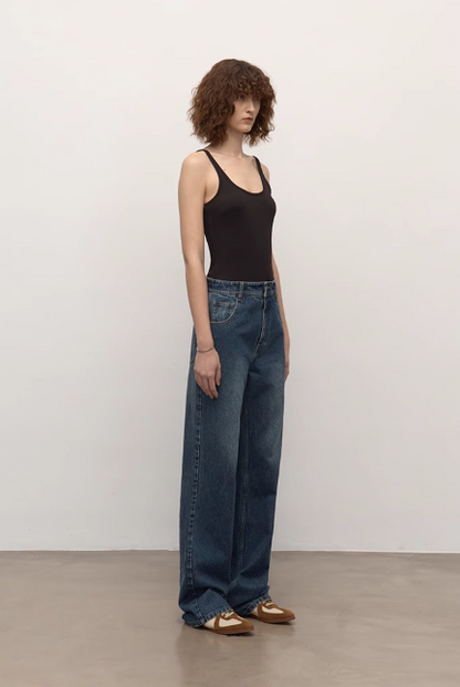 Brown Coeus long-staple cotton micro-stacked straight jeans, showcasing a casual fit and detailed stitching.