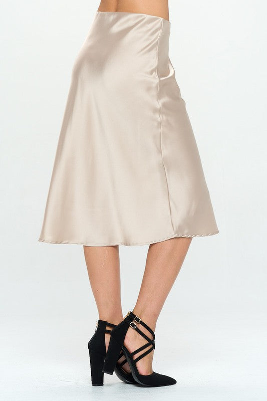 Made in USA Jade Icarus solid satin midi skirt, showcasing smooth fabric and stylish length on a mannequin.