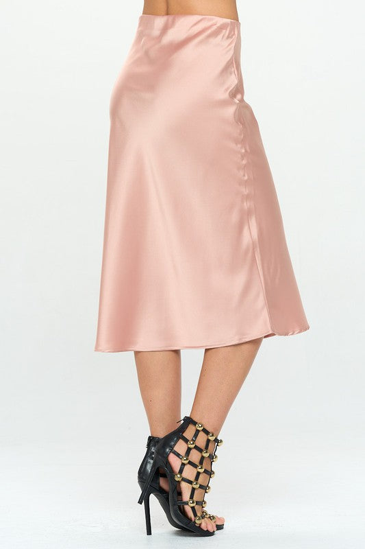 Jade Icarus made in USA solid stretch satin midi skirt, showing smooth fit and elegant midi length in a neutral color.