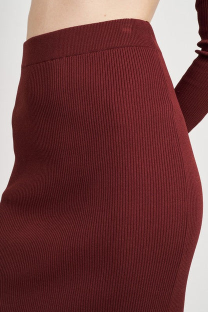 Jade Icarus high waist midi pencil skirt for women, fitted silhouette, beige fabric, styled with a tucked-in blouse.