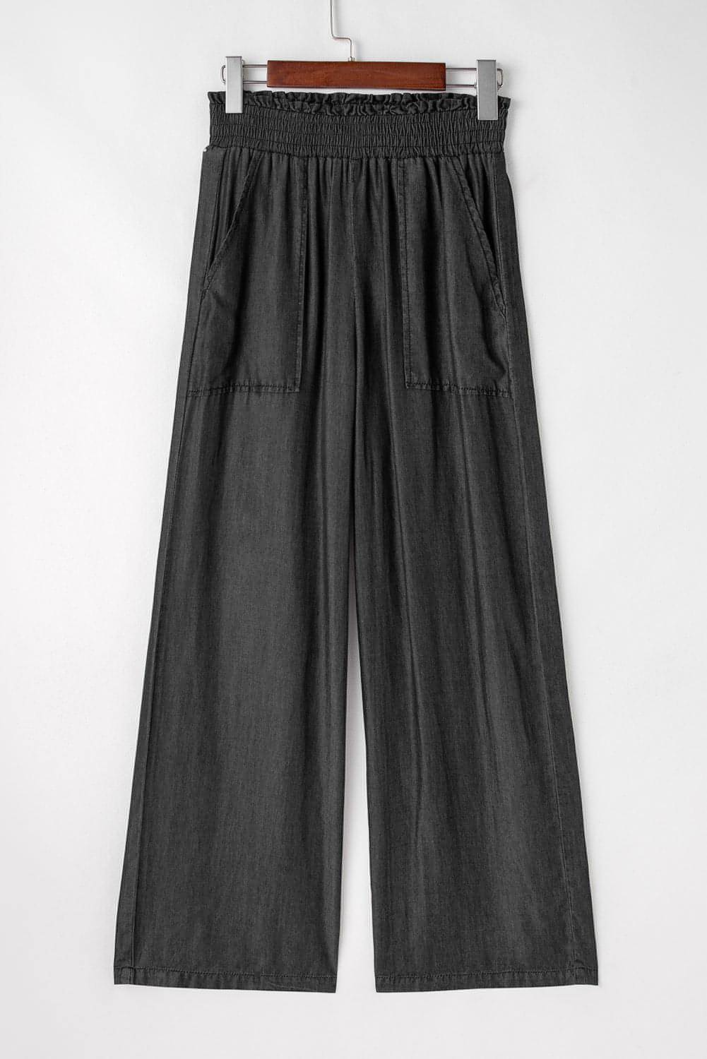 Black Carmine Juneberry high waist wide-leg jeans with side pockets, frilled hem, and smocked waistband, casual and stylish.