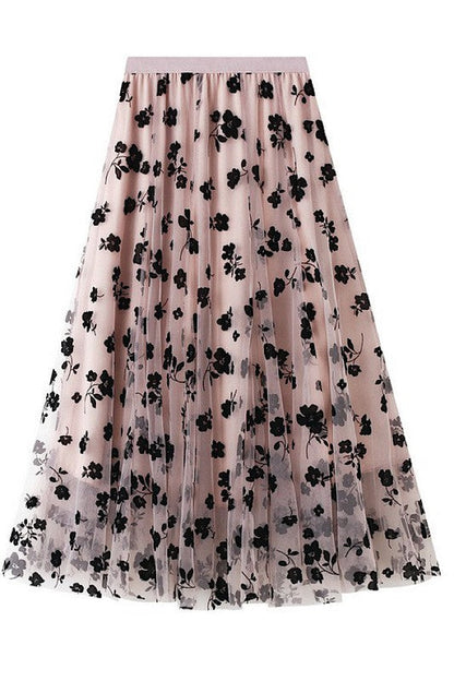 Floral chiffon midi skirt by Jade Icarus, featuring a flowy, patterned fabric with a soft, elegant silhouette.