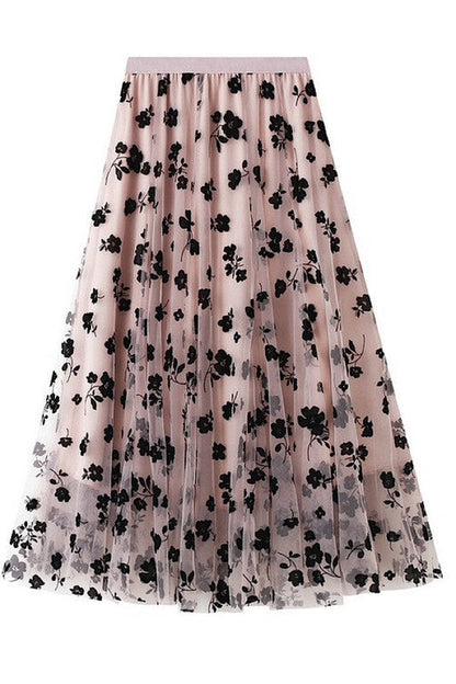 Floral chiffon midi skirt by Jade Icarus featuring colorful flower patterns and lightweight fabric, displayed on a mannequin.