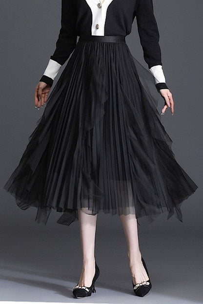 Jade Icarus pleated chiffon midi skirt in soft pastel with flowing fabric and elegant pleats, draped on a hanger.